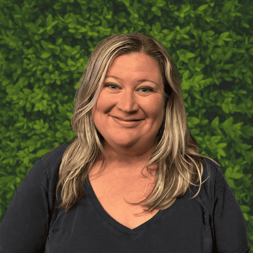 Missy Scanish smiling, professional portrait for Graham Behavior Services, emphasizing compassionate behavioral support.